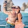Guests taking a selfie aboard a catamaran near El Arco rock formation in Cabo San Lucas